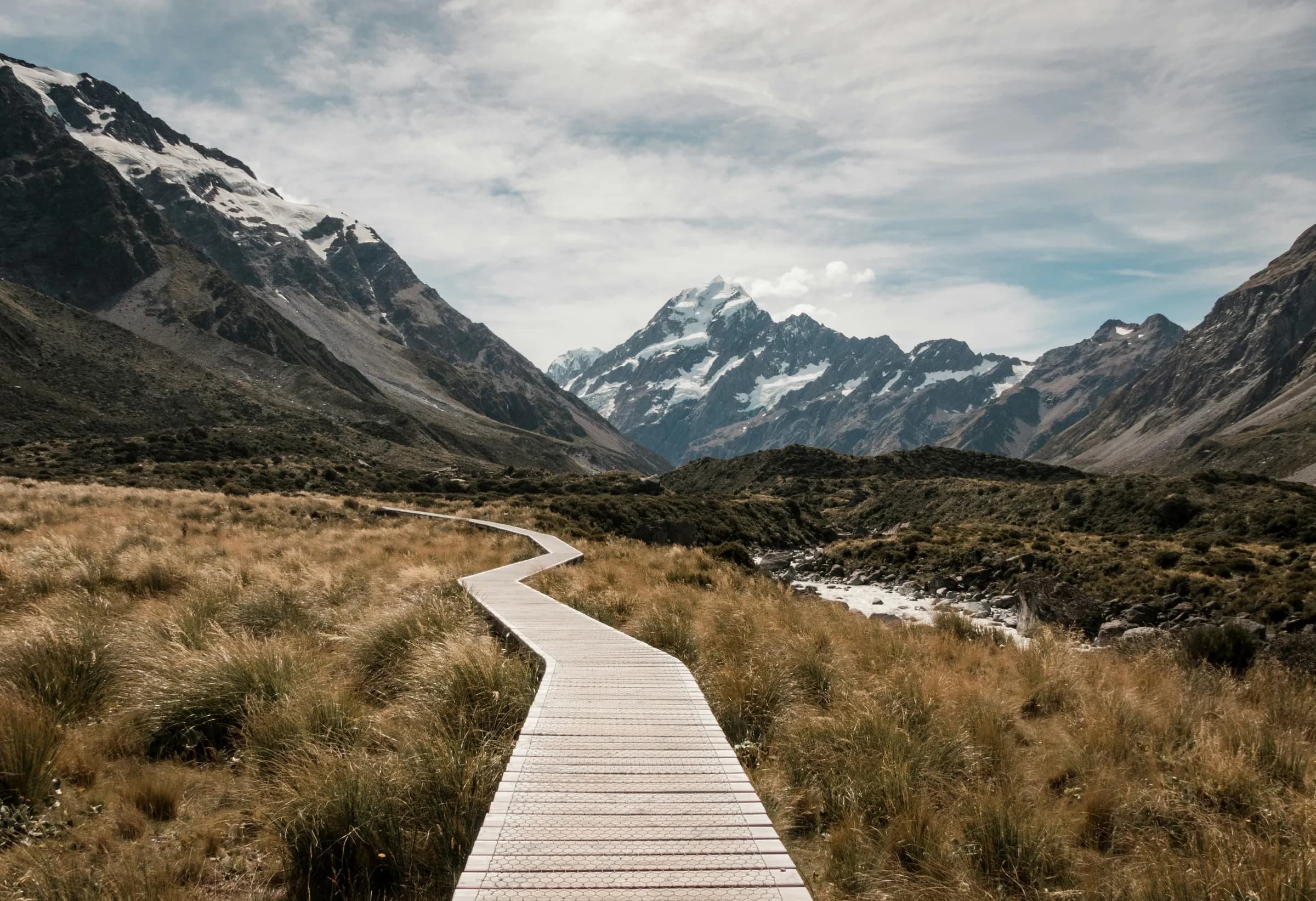 Boardwalk track winding through the Hooker Valley towards Aoraki / Mount Cook, New Zealand